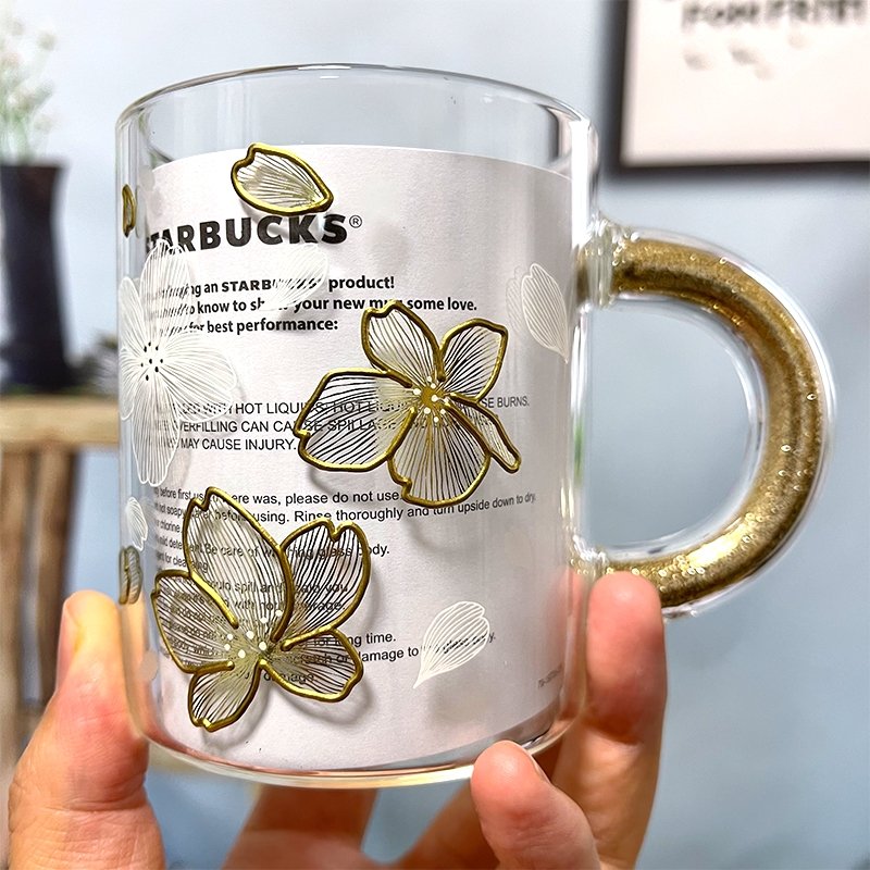 https://loveinstarbucks.com/cdn/shop/products/starbucks-2022-china-sakura-transparent-and-gold-rim-glass-355ml-594946_1024x.jpg?v=1674153065